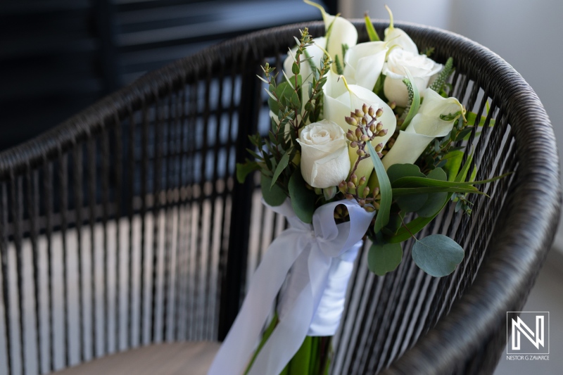 Wedding bouquet with white roses and greenery at Mangrove Beach Corendon in Curacao