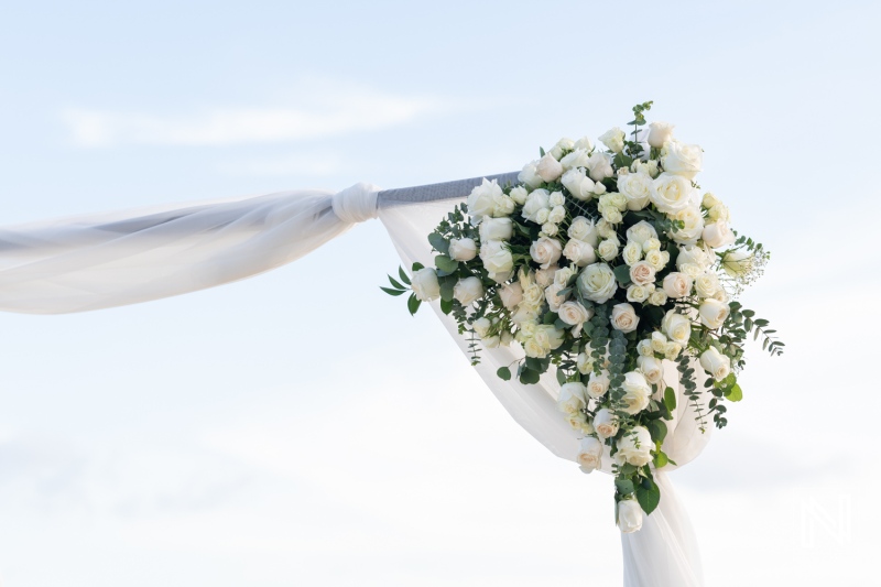 Stunning floral arrangement at a wedding ceremony in Curacao near Mangrove Beach with a serene sky backdrop