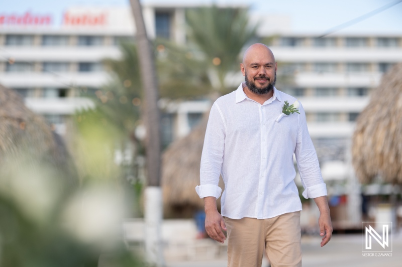 Groom walking along Mangrove Beach ready for a romantic wedding ceremony in Curacao with tropical ambiance