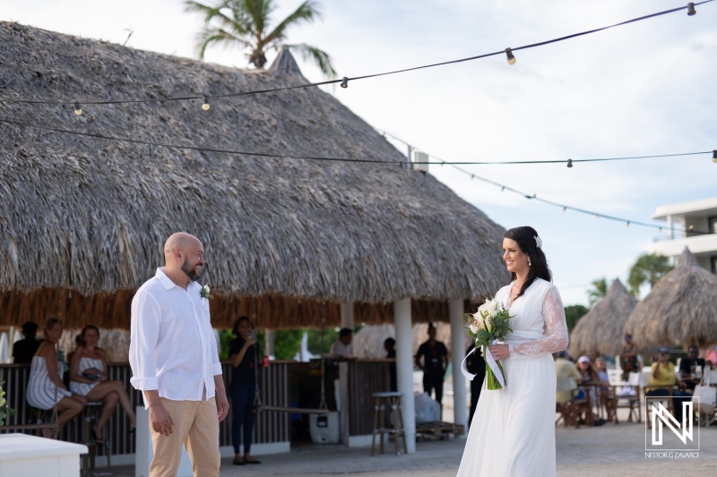 Wedding ceremony at Mangrove Beach in Curacao features bride and groom in a tropical setting surrounded by guests