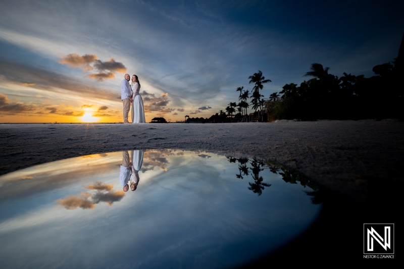 Wedding celebration at sunset on Mangrove Beach in Curacao with stunning reflections and a beautiful sky