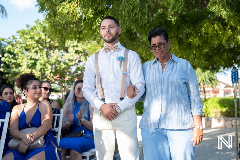 Groom walking down the aisle