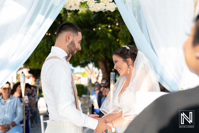 Bride and groom holding hands