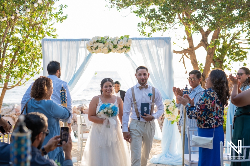Bride and groom walking down the aisle