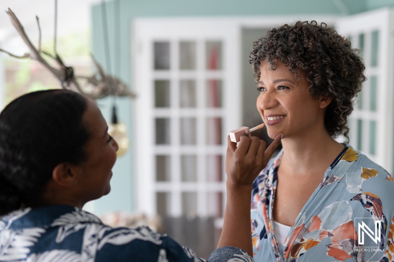 Making preparations for a wedding in Curacao with makeup application before the ceremony starts