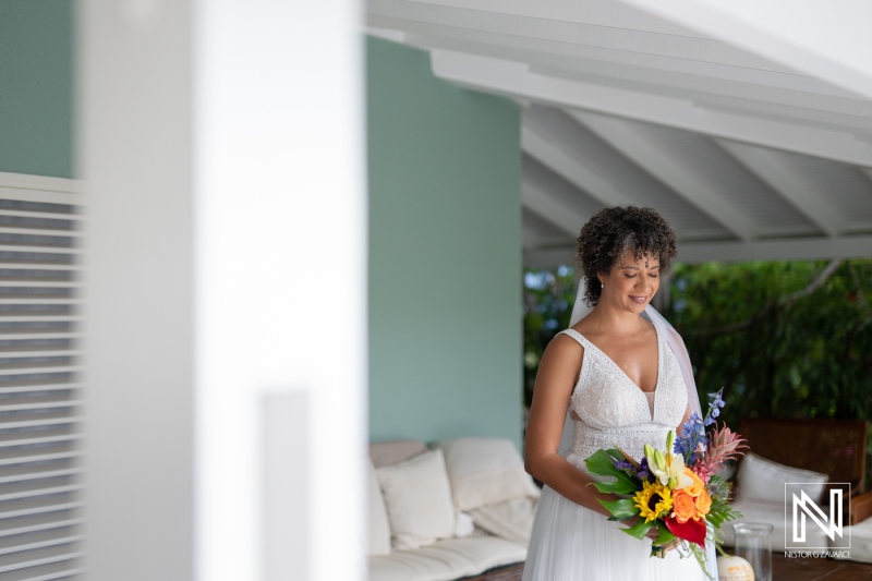 Couple prepares for wedding in Curacao with beautiful tropical flowers and a joyful atmosphere