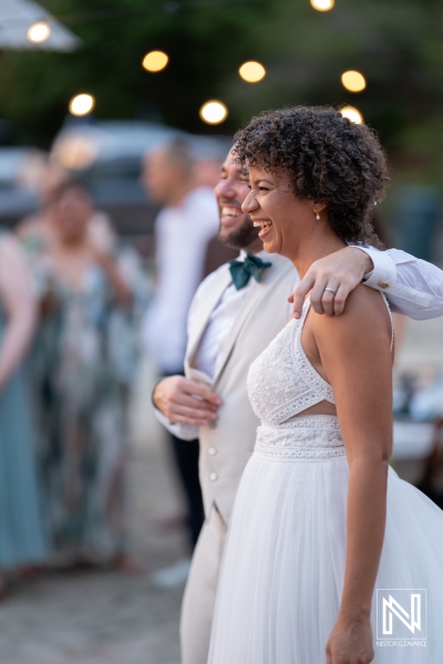 Wedding celebration in Curacao with couple smiling and enjoying the moment