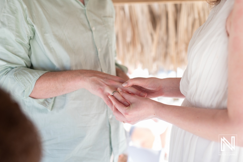 Bride exchanging wedding ring with the groom