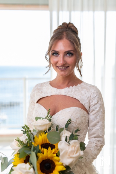 Stunning bride at Sunscape Curacao Resort with breathtaking ocean view during a joyful wedding celebration