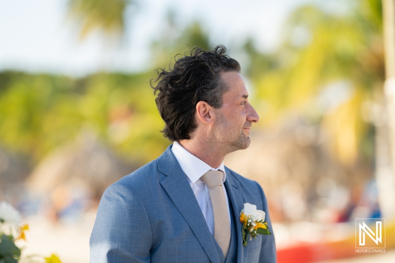 Groom waits with anticipation for his bride during a beautiful wedding ceremony at Sunscape Curacao Resort in the warm Caribbean sun