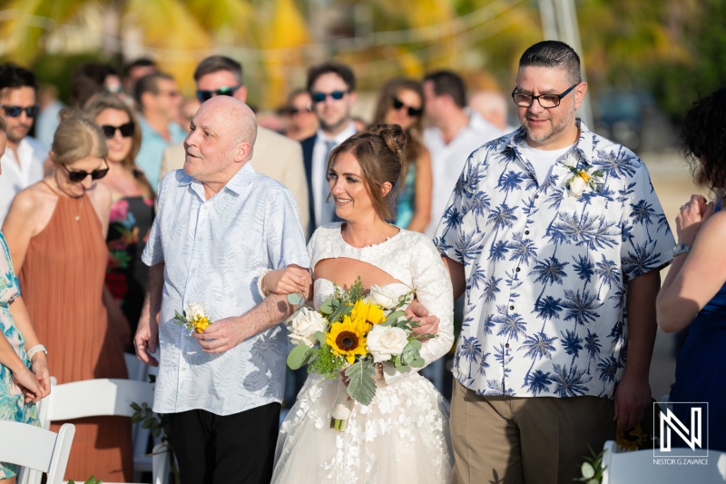 Wedding ceremony at Sunscape Curacao Resort features joyful couple and guests celebrating love on a beautiful sunny day