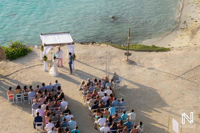Ceremony at Sunscape Curacao Resort overlooking the turquoise waters with guests witnessing a joyful wedding celebration