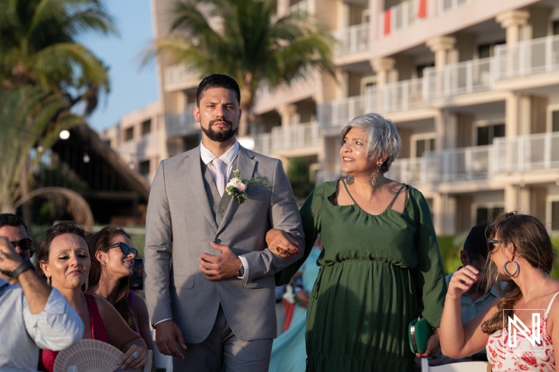 Groom walking down the aisle