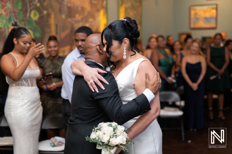 Couple shares heartfelt dance during wedding celebration at Curaçao Museum