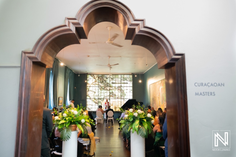 Wedding ceremony held at Curaçao Museum with guests gathered in a beautifully decorated hall