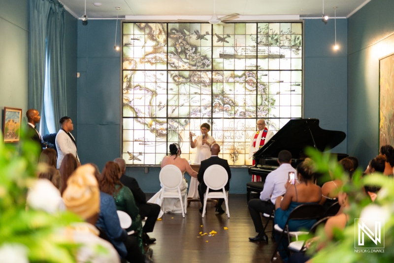 Wedding ceremony taking place at The Curaçao Museum, featuring live music and a beautiful backdrop of Caribbean history