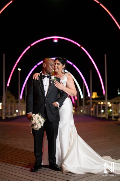 Romantic wedding celebration in Curacao at The Curaçao Museum with vibrant lights