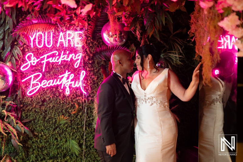 Couples exchange vows in a vibrant celebration at The Curacao Museum during a picturesque wedding in Curacao late in the evening