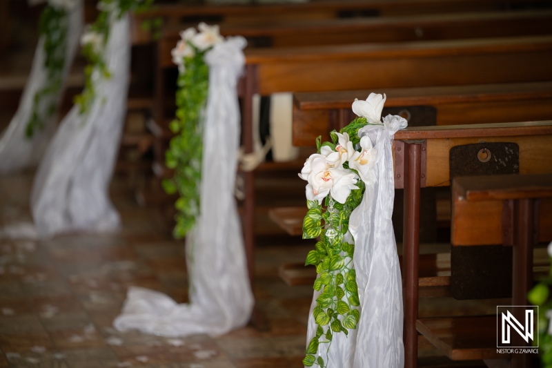 Wedding decorations in Curacao showcase floral arrangements in a setting preparing for a ceremony