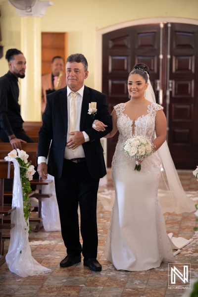 Wedding ceremony in Curacao with bride and father walking down the aisle