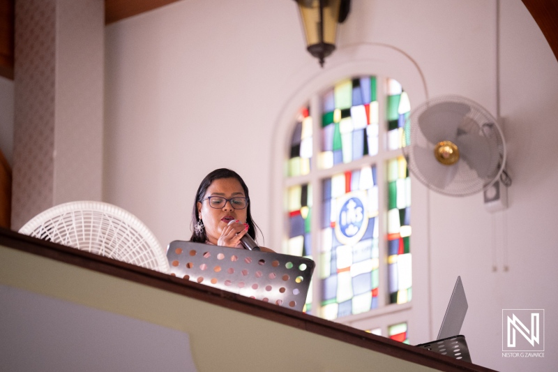 Celebration of a wedding in Curacao with a woman speaking from a balcony area
