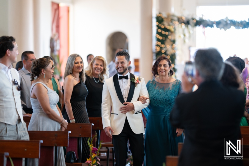 Groom walking down the aisle