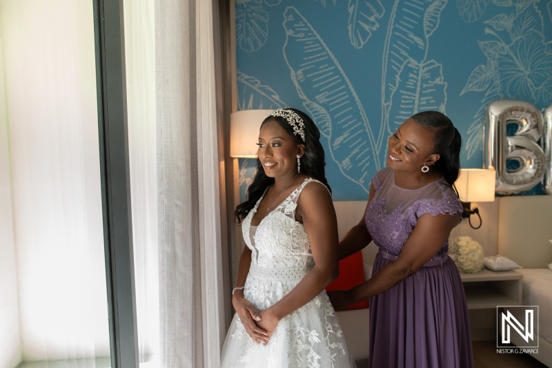 Bride getting into attire