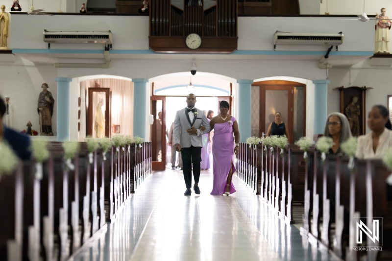 Groom walking down the aisle
