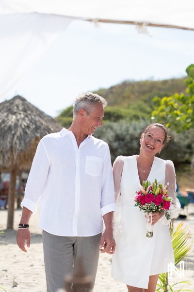 Bride and groom walking down the aisle