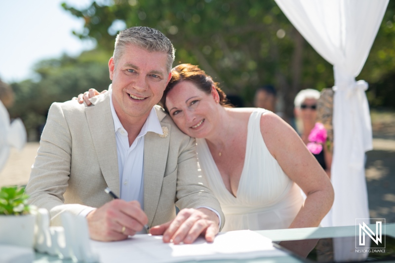 Couple celebrates love at Daaibooi Beach in Curacao during their beautiful wedding ceremony