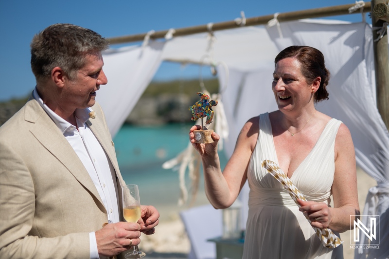 Ceremonial celebration at Daaibooi Beach in Curacao during a beautiful wedding day with joyful guests