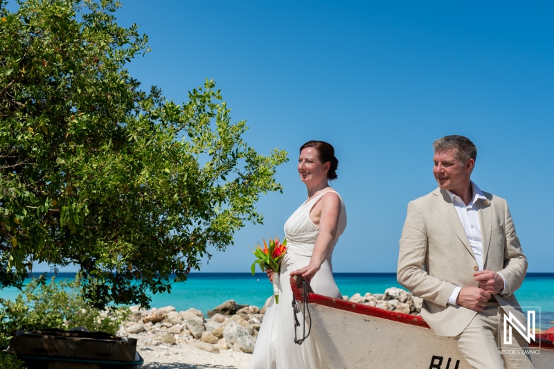 Wedding celebration at Daaibooi Beach in Curacao featuring a beautiful couple enjoying the sunny day together