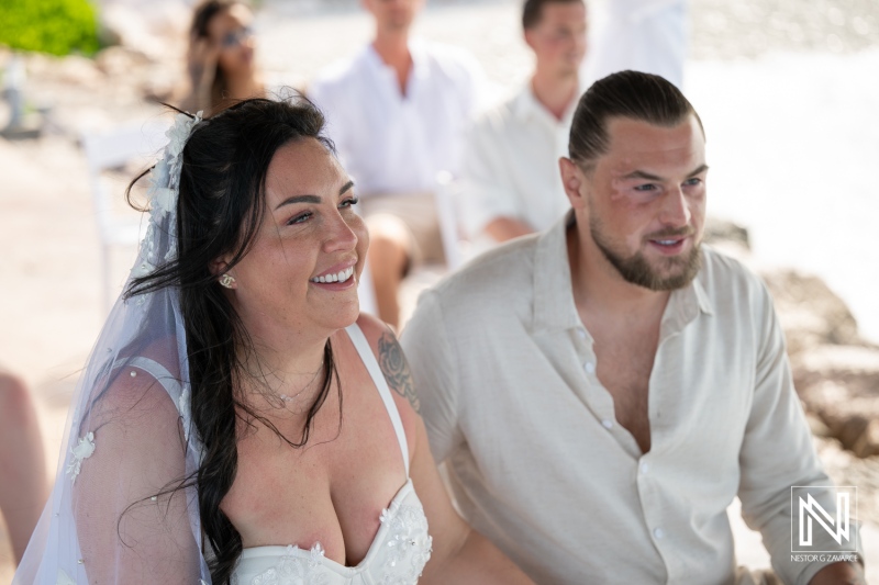 Wedding ceremony at Karakter in Curacao with couple smiling during the event