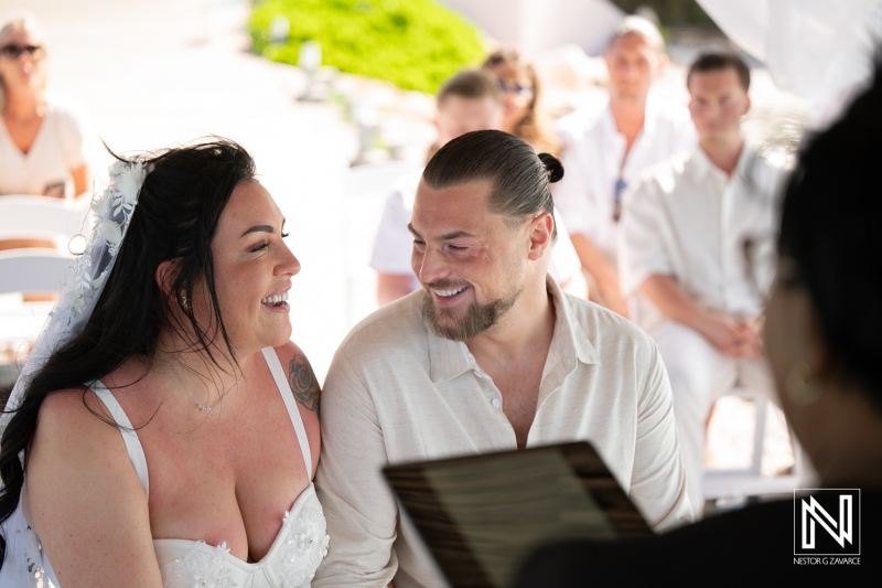 Couple smiles at each other during their wedding ceremony at Karakter in Curacao