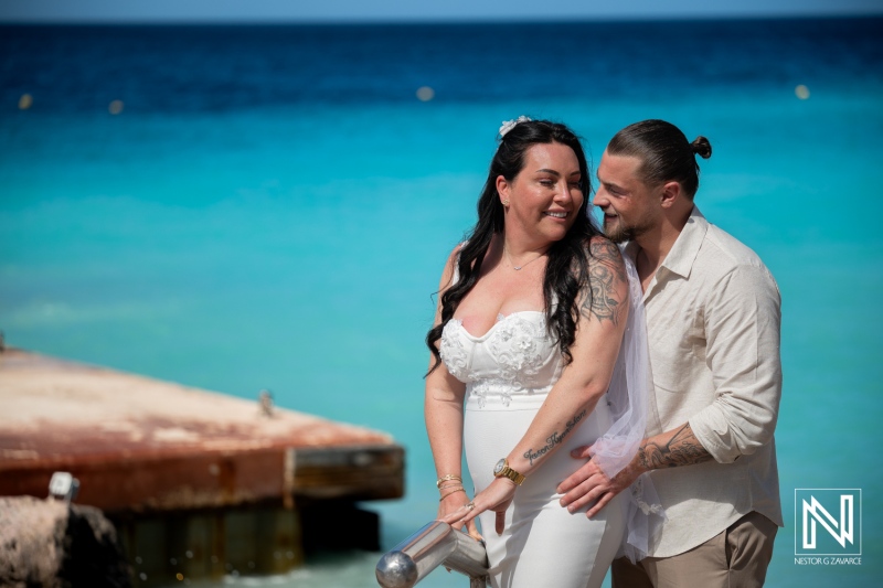 Couple shares a moment at their wedding ceremony by the sea in Curacao at Karakter