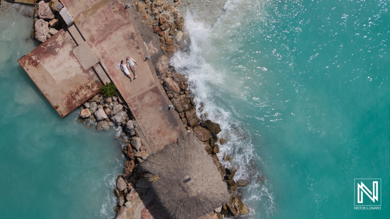 Couple celebrates wedding at Karakter in Curacao with a scenic view over turquoise waters