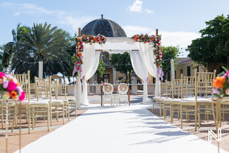 Beautiful outdoor wedding setup at Avila Beach Hotel in Curacao with floral decor and elegant seating arrangements