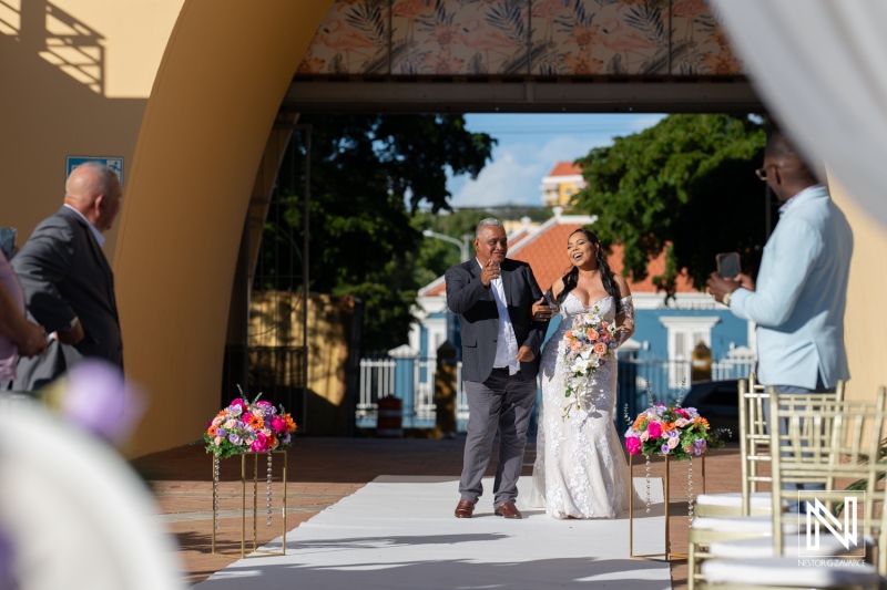 Celebration of love at a Curacao wedding ceremony held at Avila Beach Hotel under bright sunny skies