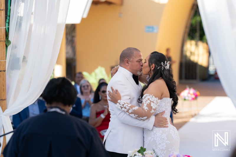 Couple exchanges vows during a romantic wedding ceremony at Avila Beach Hotel in Curacao, surrounded by breathtaking tropical scenery