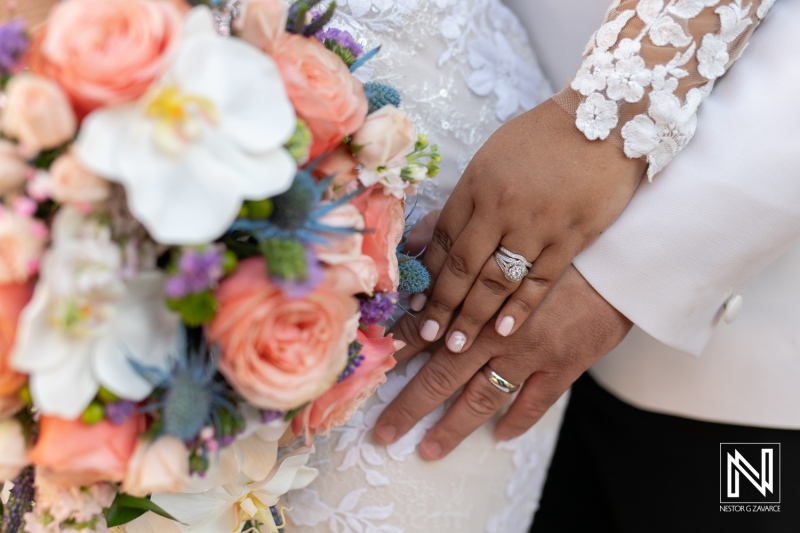 Romantic wedding moment at Avila Beach Hotel in Curacao capturing love and celebration with beautiful floral arrangements