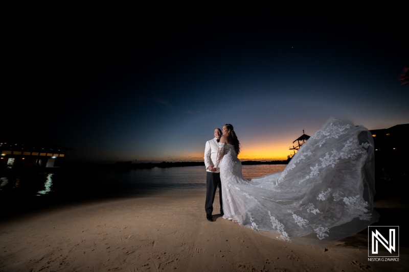 Romantic beach wedding at Avila Beach Hotel in Curacao during sunset