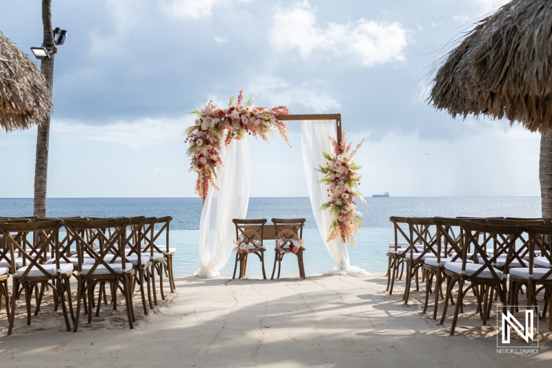 Beautiful wedding ceremony setup at Renaissance Wind Creek Curacao Resort with ocean view and floral decorations