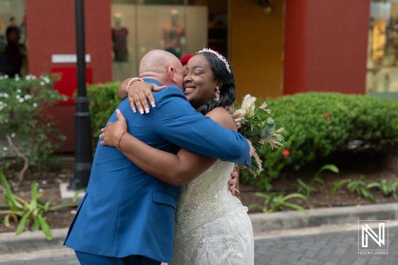 Couple shares an emotional embrace during their wedding celebration at Renaissance Wind Creek Curacao Resort