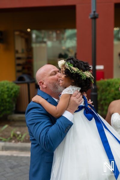 Celebration of love at a Curacao wedding with a joyful moment between a father and daughter at Renaissance Wind Creek Curacao Resort