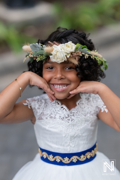 Smiling flower girl at a wedding celebration in Curacao at Renaissance Wind Creek Resort