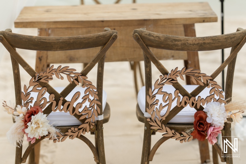 Charming wedding setup with decorative chairs at Renaissance Wind Creek Curacao Resort under a beautiful sky