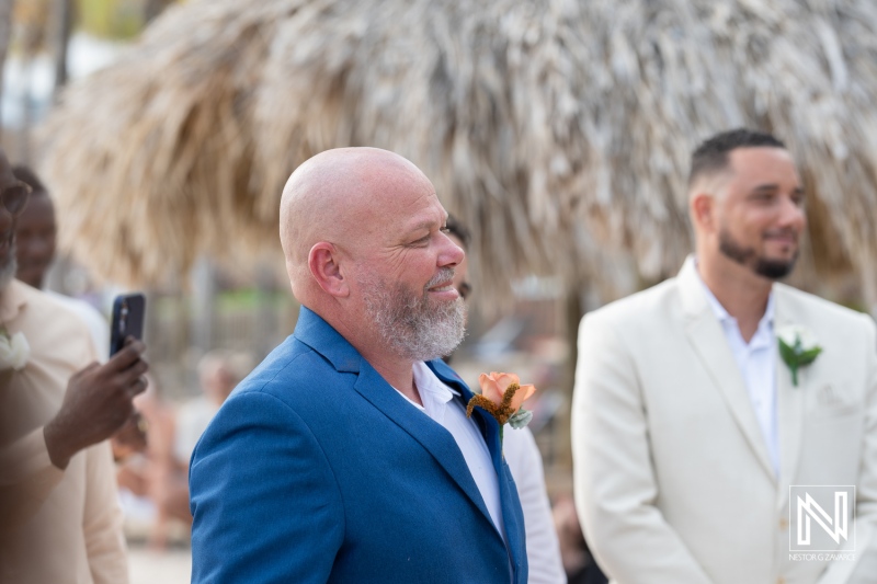 Celebration of love at a Curacao wedding in a beautiful resort, capturing the emotions of the groom and guests in a tropical setting