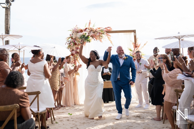 Celebration of love at a beautiful wedding ceremony in Curacao at Renaissance Wind Creek Resort