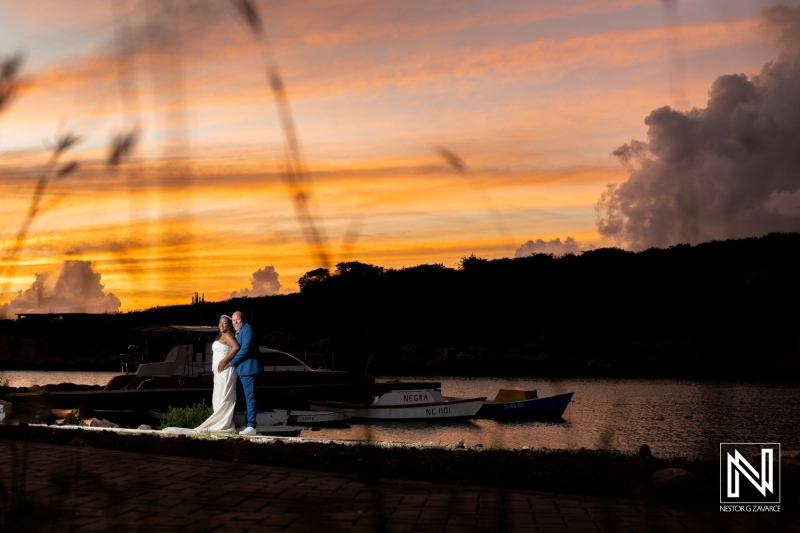Sunset wedding bliss at Renaissance Wind Creek Curacao Resort with stunning views of the colorful sky and serene waters
