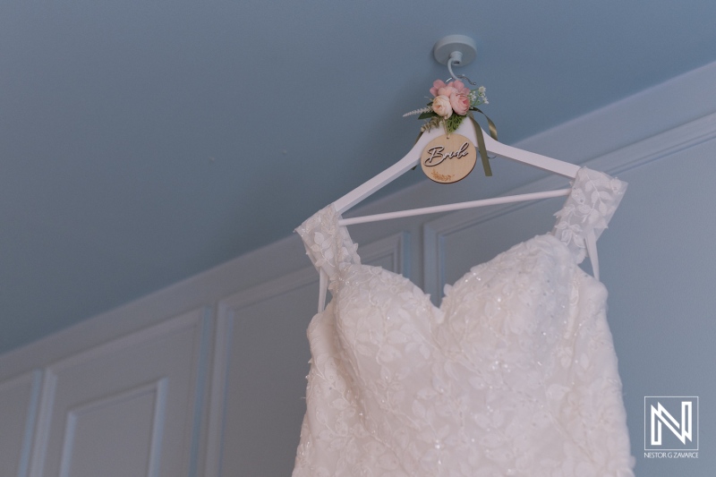 Wedding dress hanging elegantly at Renaissance Wind Creek Curacao Resort in preparation for a beautiful ceremony